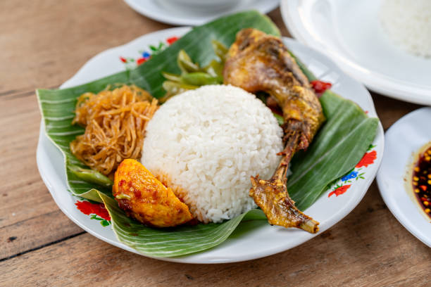 Indonesian Fried Chicken or Ayam Penyet stock photo