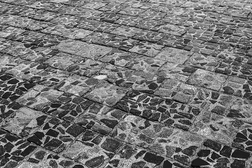 Old cobblestone street, cobblestone, tiled floor, pavement ground texture.
 old tiles.
