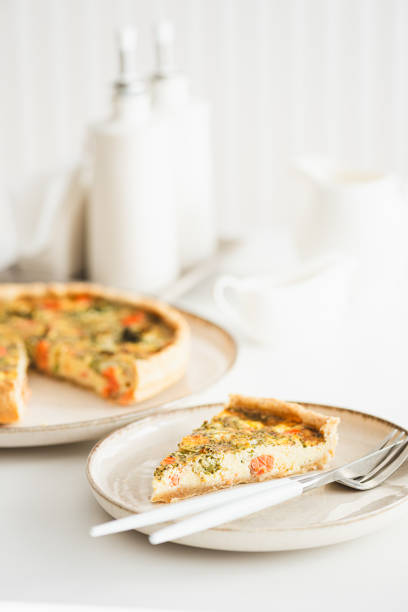 istock French quiche lauren with salmon, cheese and broccoli on white table. Soft focus 2025765902
