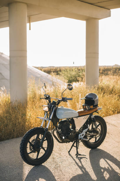 istock A stylish caferacer motorcycle stands on the road during sunset. 2025774746