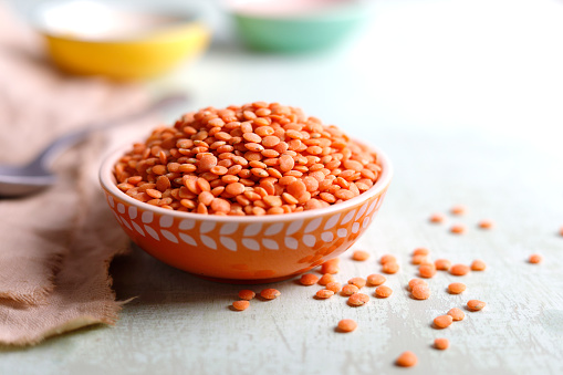 Red  lentil in a bowl with  copy space