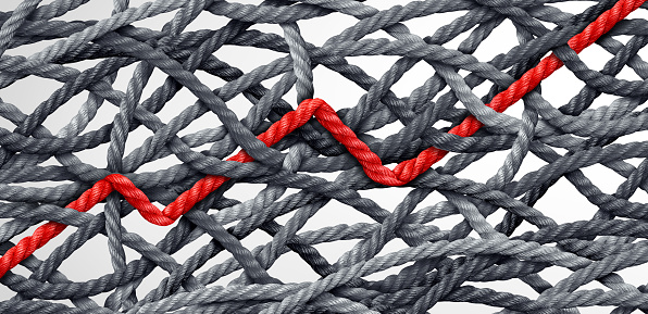 Overcoming Confusion For Success and to succeed through a complicated Entanglement with confused connections as overlapping ropes with a red rope focused on a goal.
