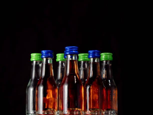 istock Small bottles of alcoholic drinks in ice cubes. 2025856740