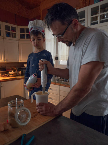istock Father and son cooking pancake for breakfast together 2025887985