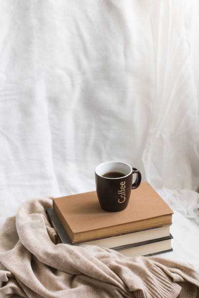 istock Simple composition of indoor relaxation with coffee and books. 2025888530