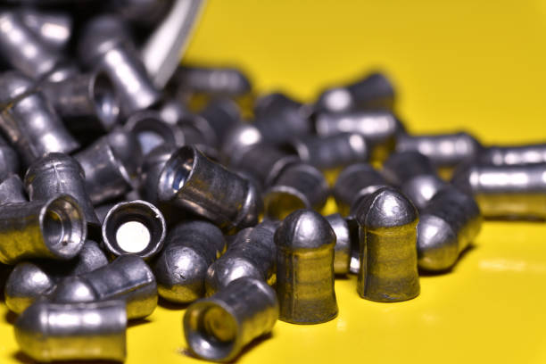 Airgun pellets on yellow background