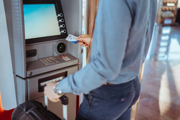 istock Businessman withdrawing money from ATM 2025891668