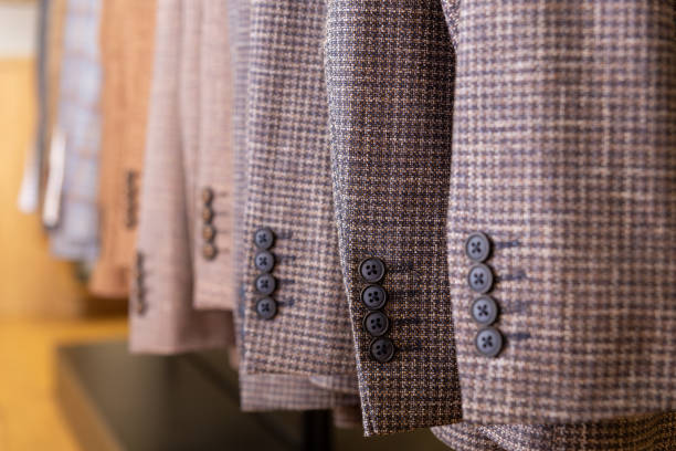 istock A row of men's suits, jackets hanging on a rack for display. 2025895871