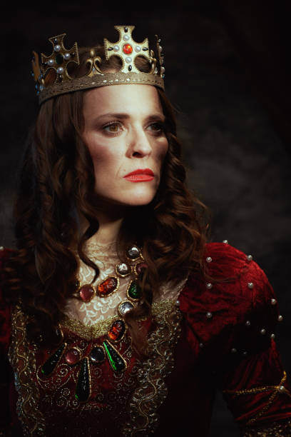 istock medieval queen in red dress with crown 2025931352
