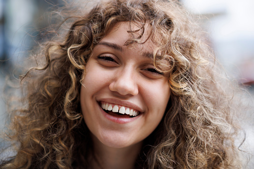 Portrait of natural young woman laughing