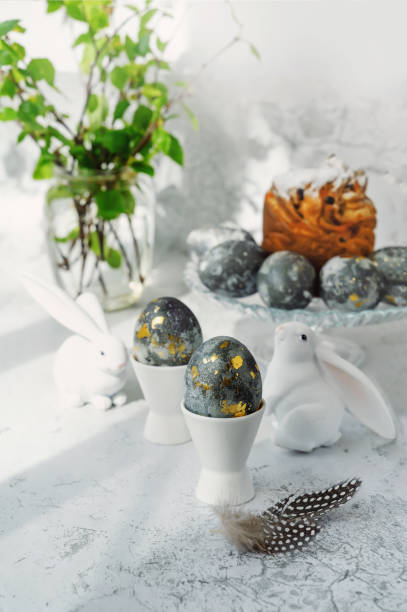 istock Easter eggs with gold pattern. A plate with Easter eggs and bunny figures. The concept of home comfort in the bright holiday of Easter 2025988671