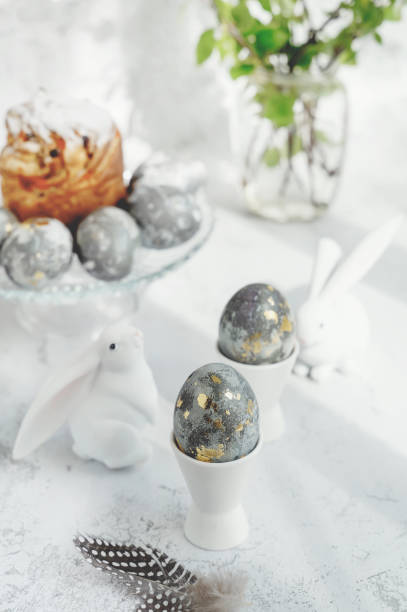 istock Easter eggs with gold pattern. A plate with Easter eggs and bunny figures. The concept of home comfort in the bright holiday of Easter 2025988683