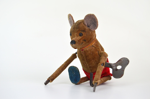 Very old worn broken bear wind-up toy