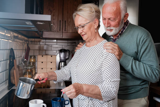 istock Beautiful senior pensioners married couple preparing a coffee at home kitchen 2026031896