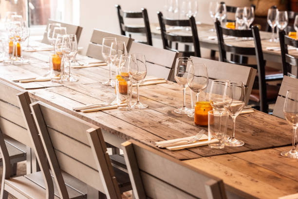 Table setting for dinner in empty restaurant, close up, directly above