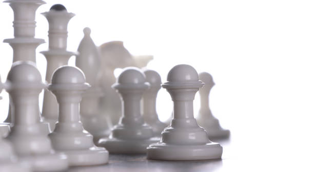 istock Close-up. White chess pieces on a chessboard. Light background. 2026071210