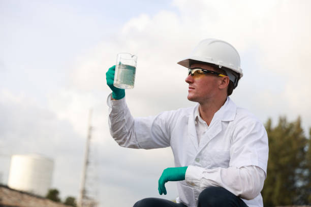 istock A male biologist taking a water sample from refinery 2026078559