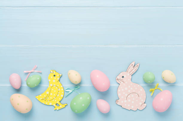 istock Easter eggs and decoration on wooden background, top view 2026096019