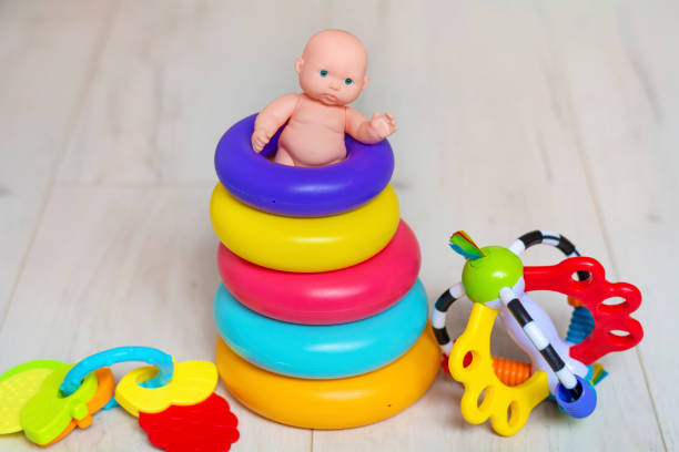 Collection of colorful toys on a blue concrete background. Kids toys