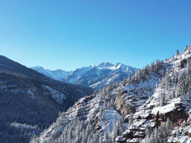 Drone Footage of Snow Covered Peaks and Trees Flying Towards A Beautiful Mountain Located in the Rocky Mountains of Colorado. Drone Footage of Snow Covered Trees Revealing a Beautiful Valley Located in the Rocky Mountains of Colorado.