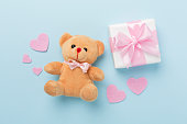 Valentines day composition with gifts on color background, top view.
