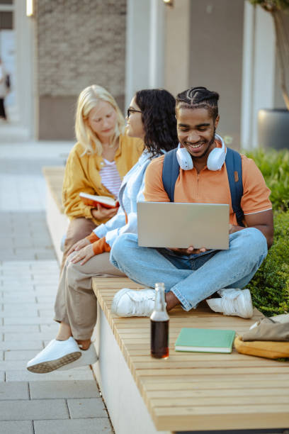 istock African American male student using laptop on the bench on campus 2026130083