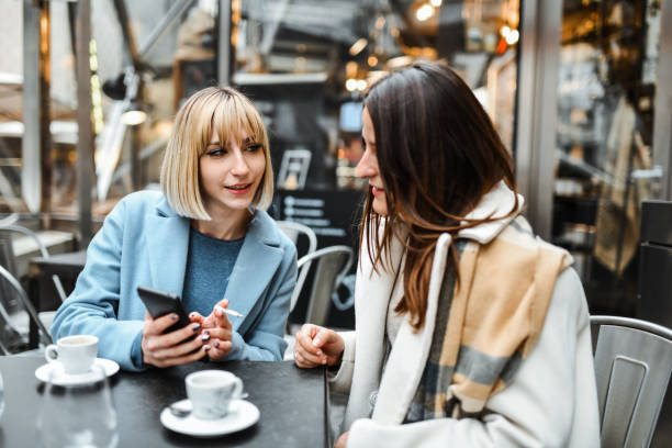 istock Females Exploring Social Media On Smartphone During Coffee Time 2026146065