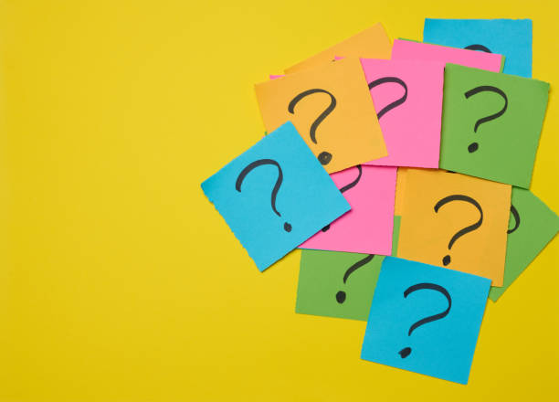 istock Drawn question marks on stickers, yellow background. Searching for truth 2026178703