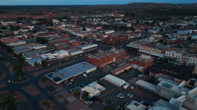 drone shot revealing Kalgoorlie boulder city center with mine shaft in the background, famous Australian mining city, Western Australia