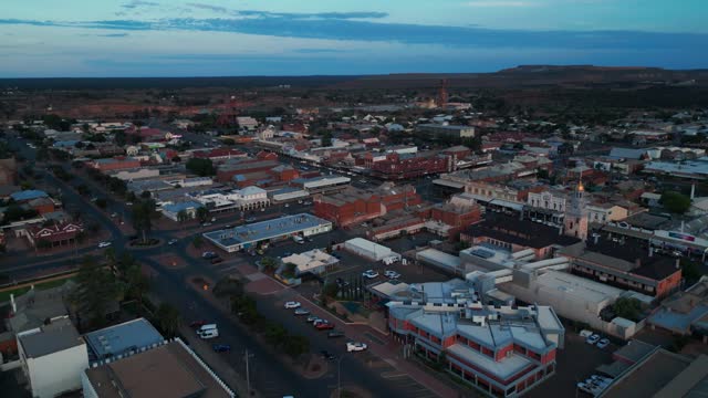 drone shot going backward over Kalgoorlie Boulder city center, famous australian mining town in western australia
