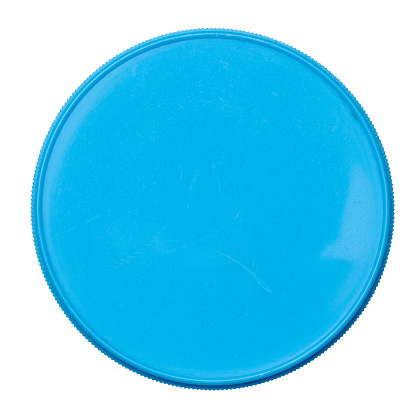 Round blue plastic jar lid on isolated background, top view