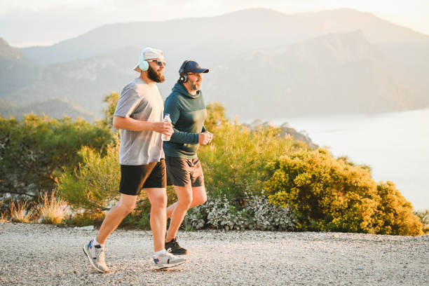 istock Two best friends walking and doing sports on the beach 2026215536