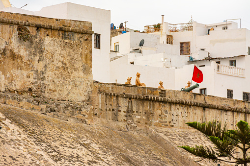 Tangier, Morocco. October 16th, 2022 - Statuary in Dar el-Baroud wall in the old fortified wall in the quarter of the Medina. Houses inside the rampart