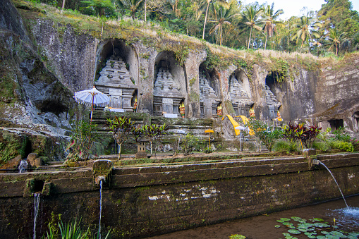 Gunung Kawi temple is an archaeological site located in Tampaksiring, Bali Island. Dating from the 11th century, the temple has a unique shape in the form of carvings on the sandstone walls on the Pakerisan river cliffs.