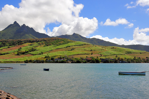 Bamboo Mountain, border of Grand Port and Flacq Districts, Mauritius: the sharp peaks of Bamboo Mountain (Montagne Bambous) seen from the waterfront of Petit Sable, by the bay