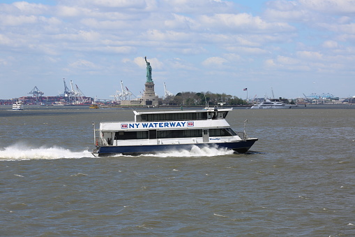 Fast Watertaxi sailing down the Hudson River in New York