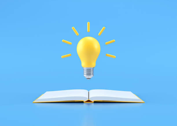 istock Light bulb on opening book, ideas design on blue background stock photo 2026318392