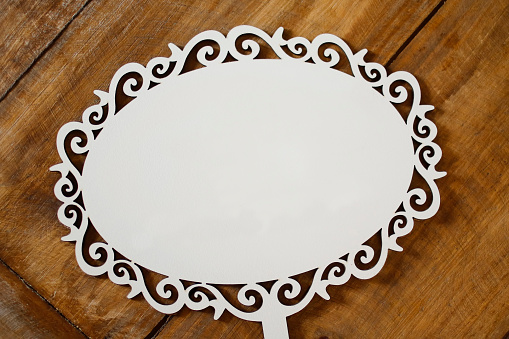 detail of carved white plate with blank space