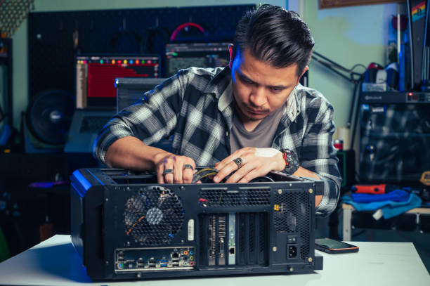 istock The technician repairing the computer. the concept of computer, CPU, motherboard, hardware, repairing, upgrade and technology. 2026360088