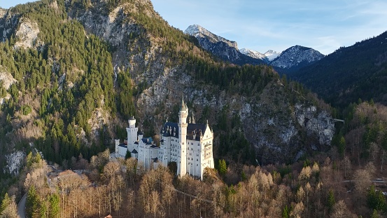 Schwangau, Germany - 02 February 2024: Drone shot of Neuschwanstein Castle, Bavarian Alps and lakes.