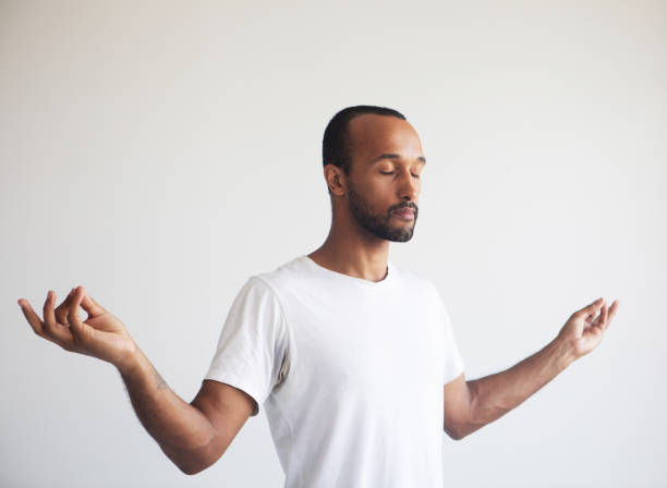 istock Young afro man concentrating his mind, meditating, yoga exercise breath technique reduce stress. 2026370360