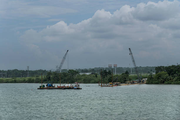 Panama Canal, Panama - 23 January 2024: Large floating industrial barge used to dredge the canal to remove silt and dirt.