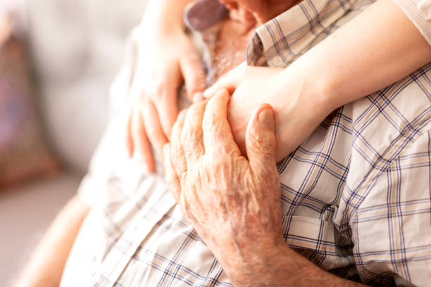 istock Comforting hand on shoulder of man 2026400977
