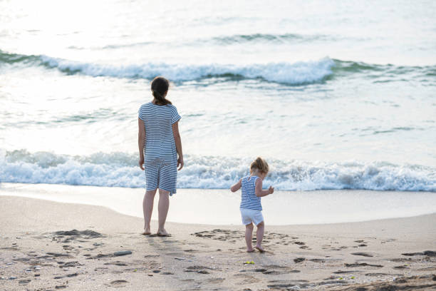 istock Family summer beach lifestyle at sunset. copy space 2026407473