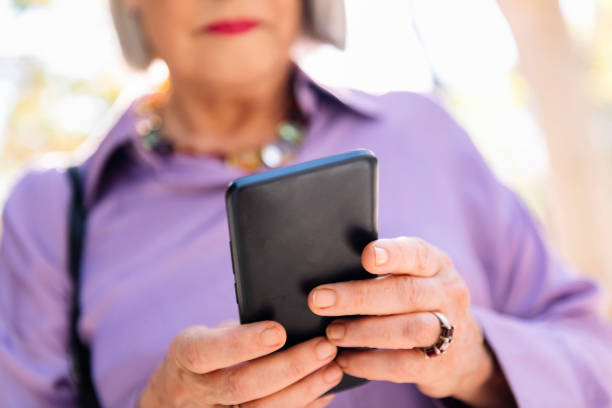 istock unrecognizable senior woman using mobile phone 2026407628