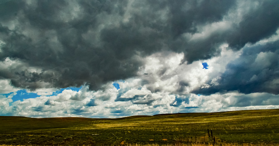 Rain clouds during the day over the plains in Utah, USA