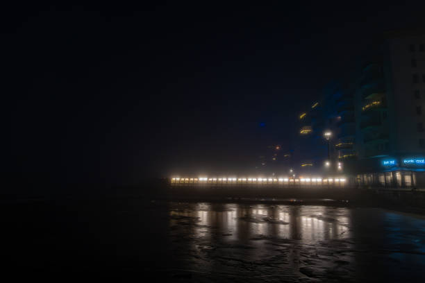 Stockholm, Sweden A pier in the fog at night in the Liljeholmskkajen district.
