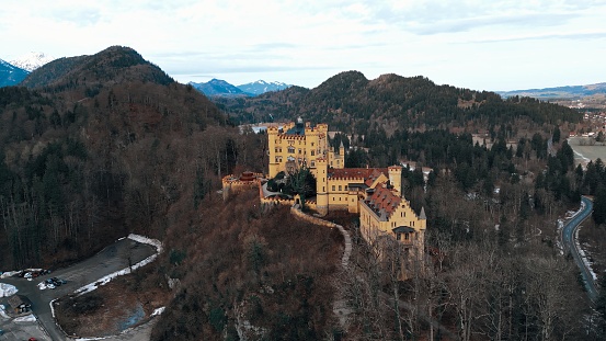 Schwangau, Germany - 02 February 2024: Drone shot of Schloss Hohenschwangau, Bavarian Alps and lakes.