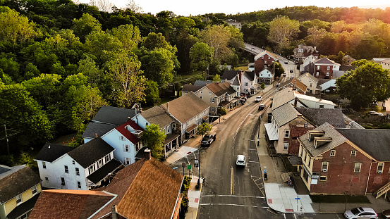 A curving road leads alongside the historic tree lined residential district in Slatington, PA