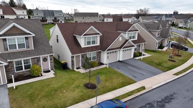 Truck shot of homes in USA. Housing in residential community. Aerial view during winter in America.